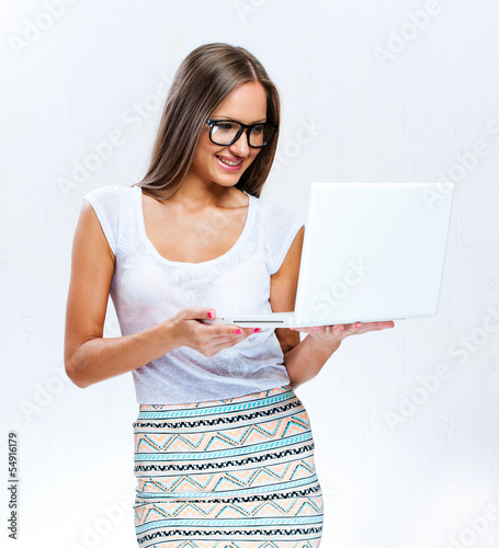 beautiful young woman holding laptop