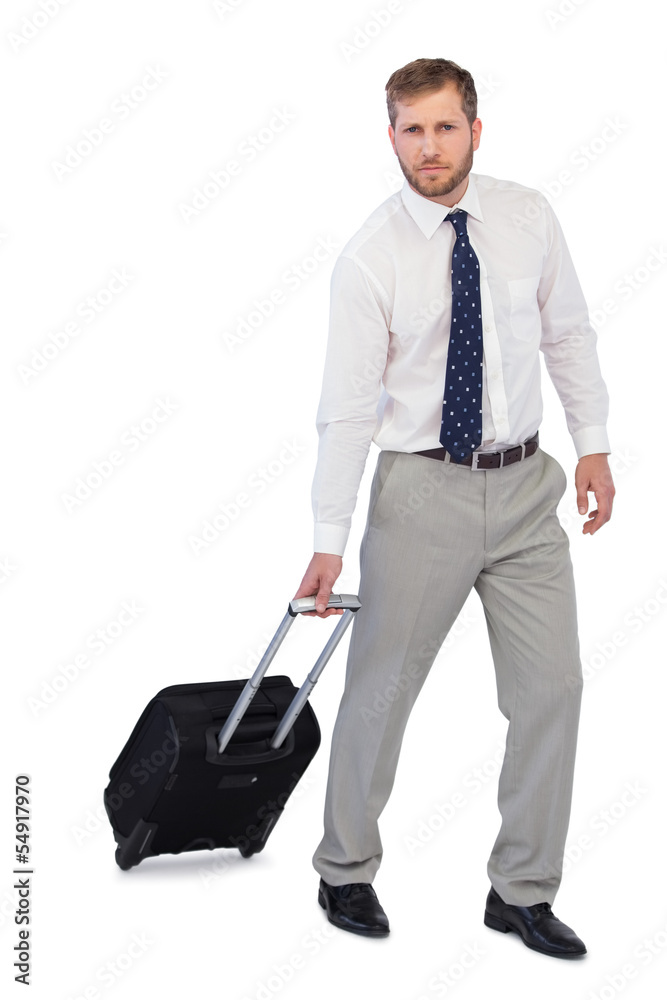 Serious businessman with suitcase Serious businessman with suitcase