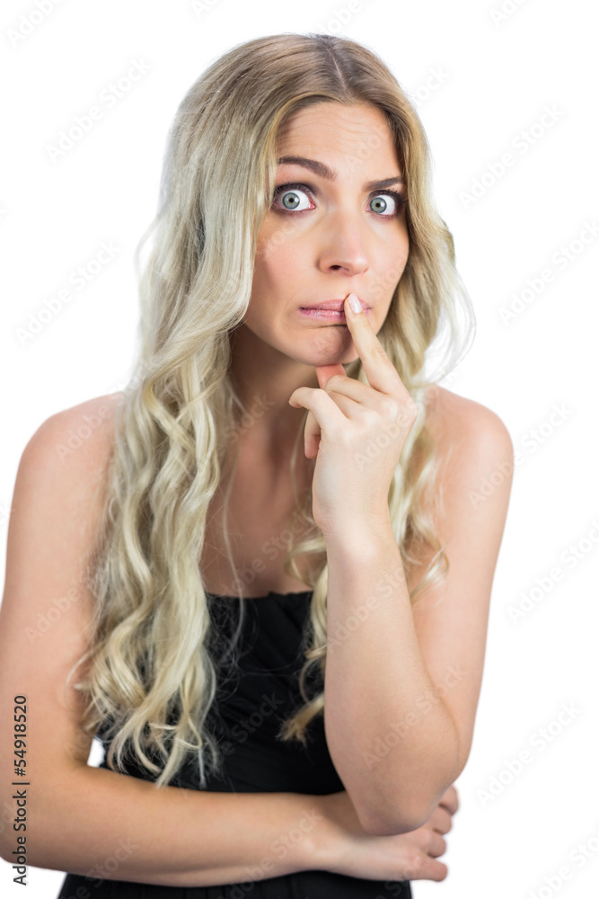 Uneasy gorgeous blonde in black dress posing Uneasy gorgeous blonde in black dress posing