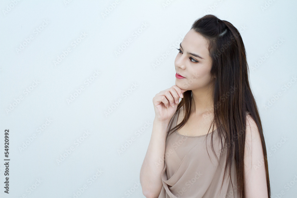 smiling beautiful woman on plain cooltone background looking at smiling beautiful woman on plain cooltone background looking at