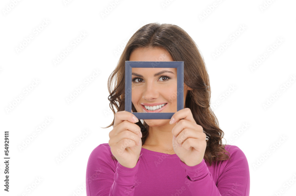 Women with picture frame. Beautiful young women smiling and look