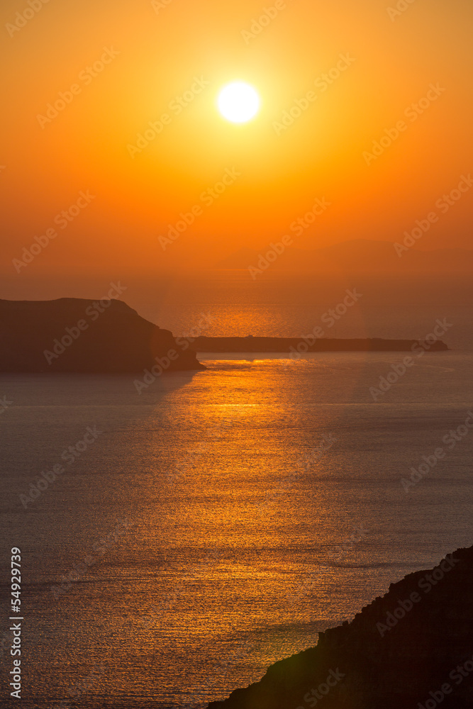 Beautiful sunset at the beach of Santorini in Greece