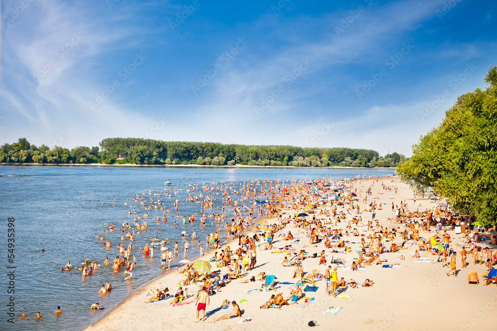 People on the public beach Oficirac on Danube river, Novi Sad, S People on the public beach Oficirac on Danube river, Novi Sad, S
