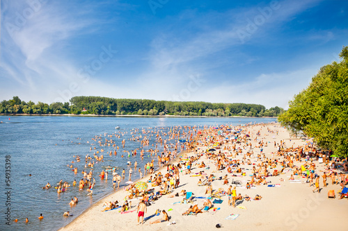 People on the public beach Oficirac on Danube river, Novi Sad, S © Aleksandar Todorovic