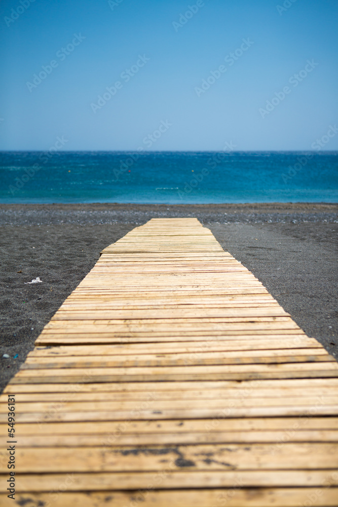 Wooden walkway to the aegean sea