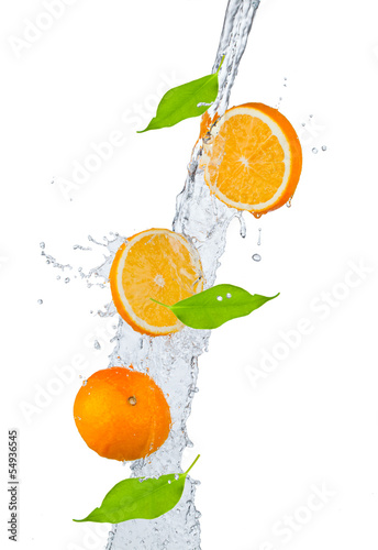 Fresh oranges falling in water splash  isolated on white backgro
