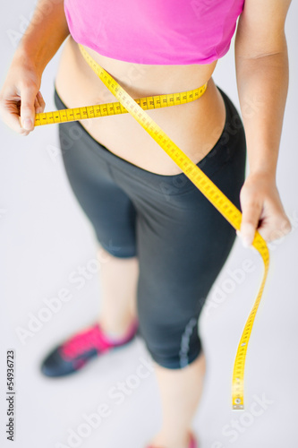 trained belly with measuring tape