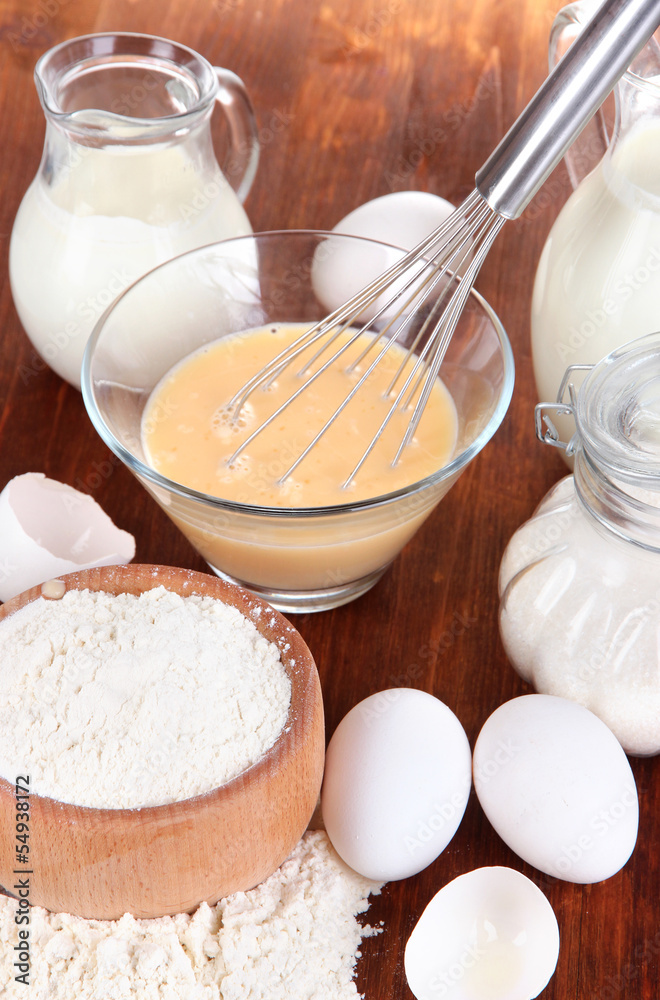 Ingredients for dough on wooden table close-up