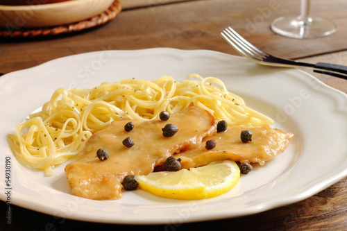 Vászonkép Chicken piccata milanese with pasta