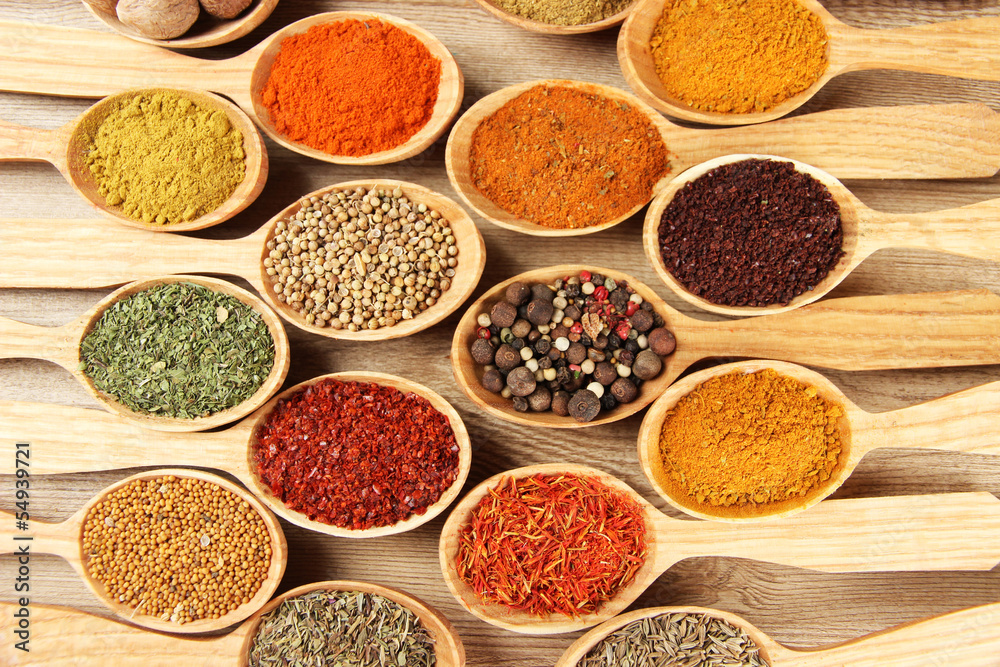 Assortment of spices in wooden spoons close-up