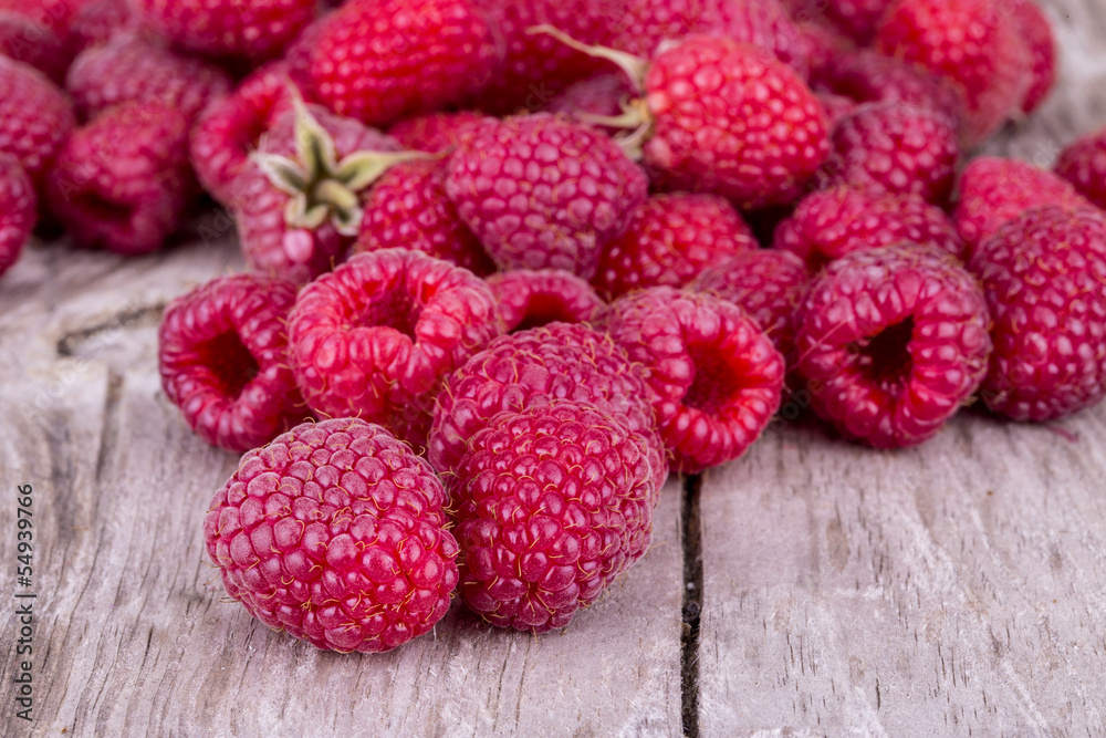 Sweet raspberry on wooden table Sweet raspberry on wooden table
