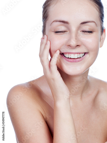 Portrait of young beautiful woman with perfect skin in water