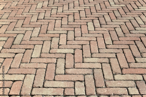 Natural brick pavement wall background