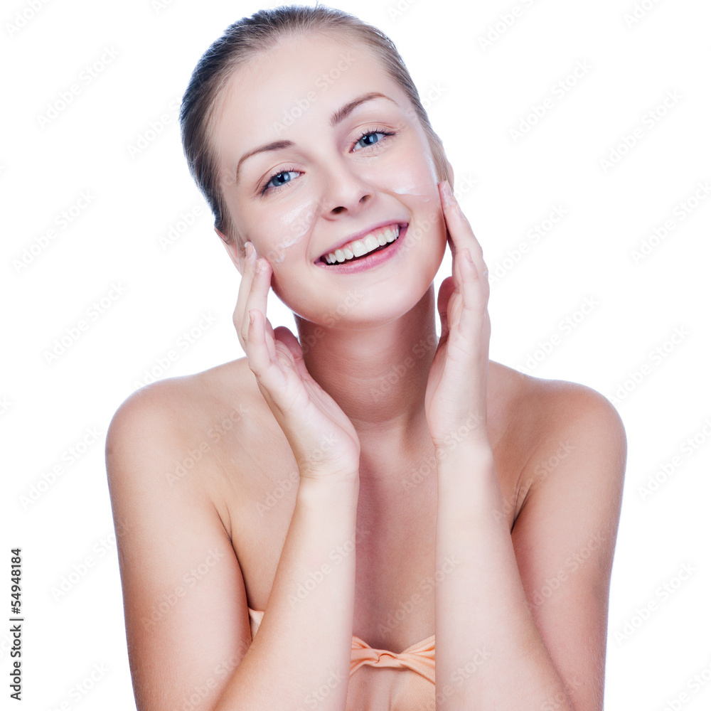 Beautiful woman washing her face - isolated on white Beautiful woman washing her face - isolated on white