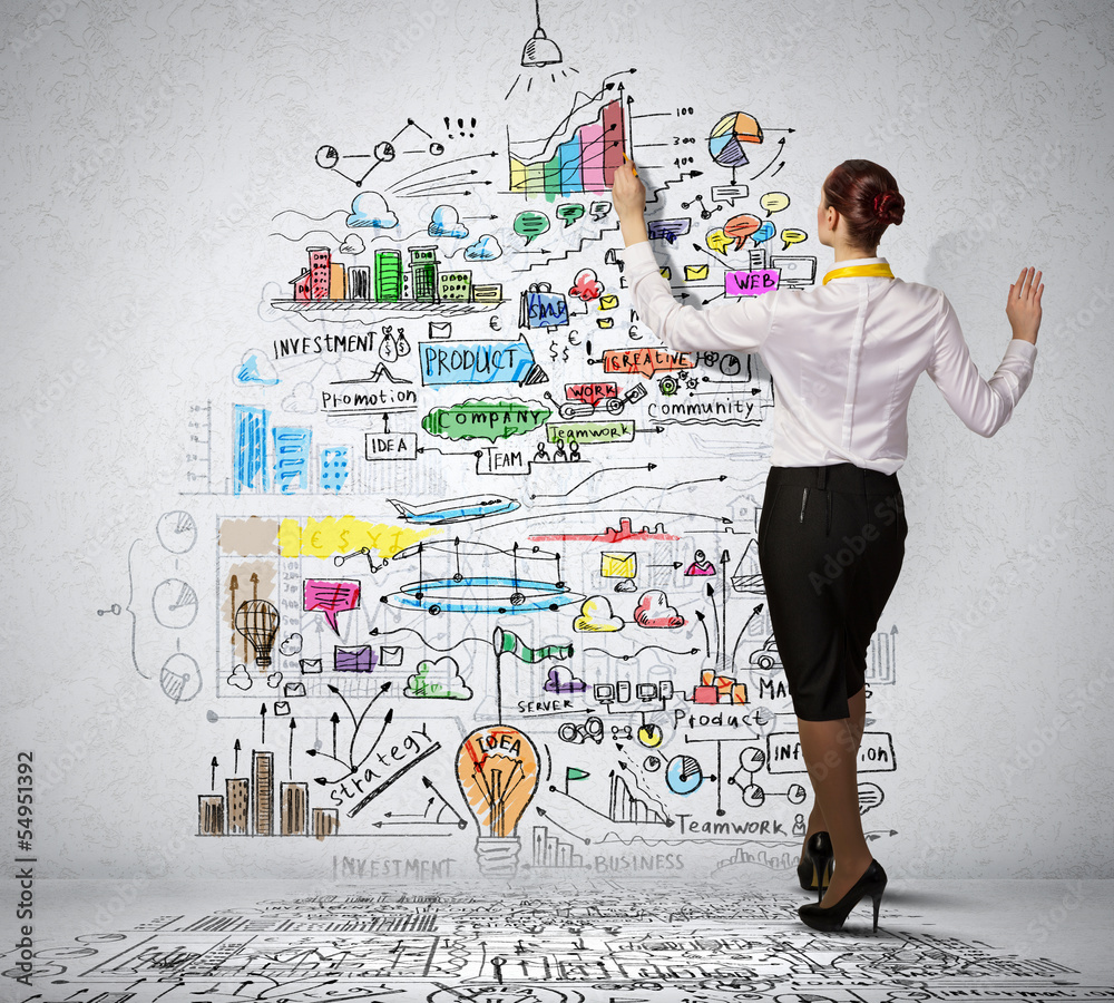 Obraz premium Businesswoman drawing on wall