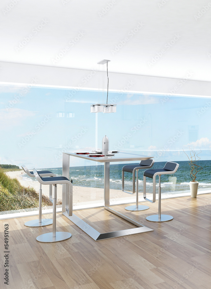 Modern interior with dining table and fantastic seascape view