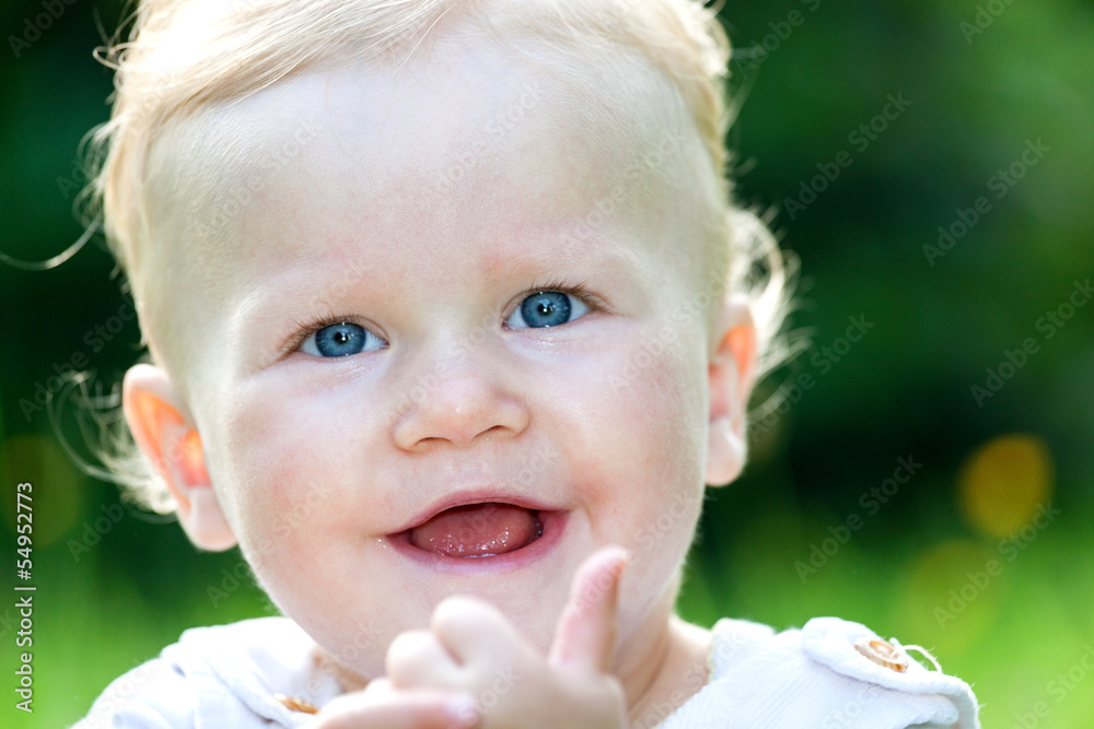 Cheerful baby girl on the summer meadow Cheerful baby girl on the summer meadow
