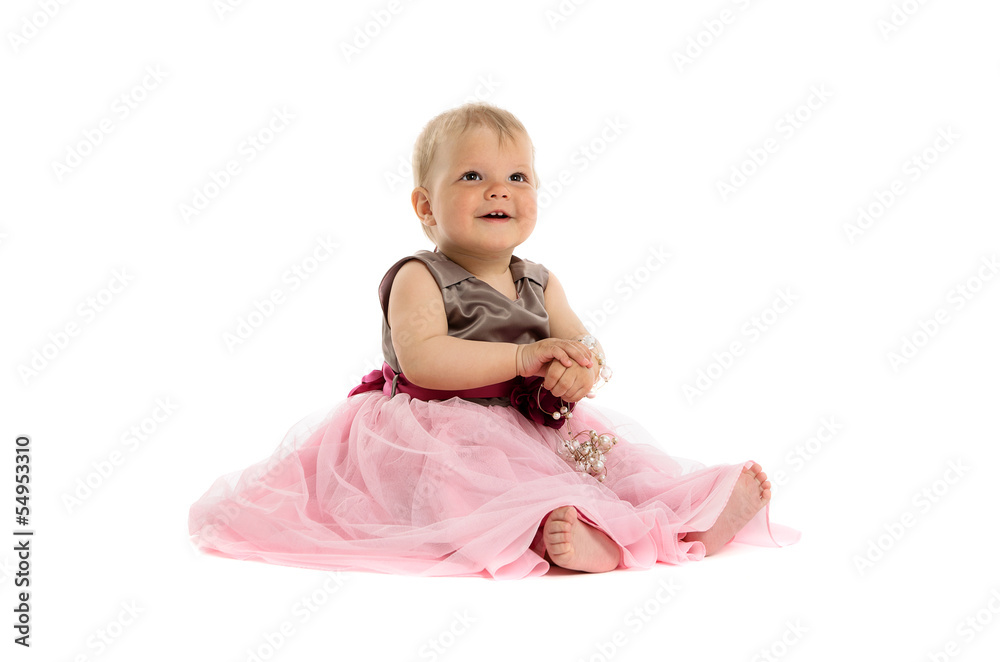 Adorable little baby girl in pink dress sitting on floor Adorable little baby girl in pink dress sitting on floor
