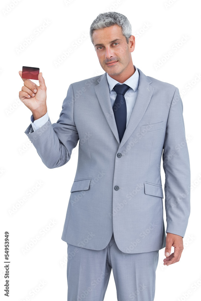 Handsome businessman showing credit card Handsome businessman showing credit card