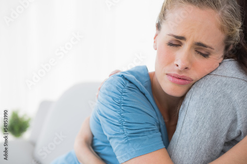 Fotografía Upset woman being consoled by her friend