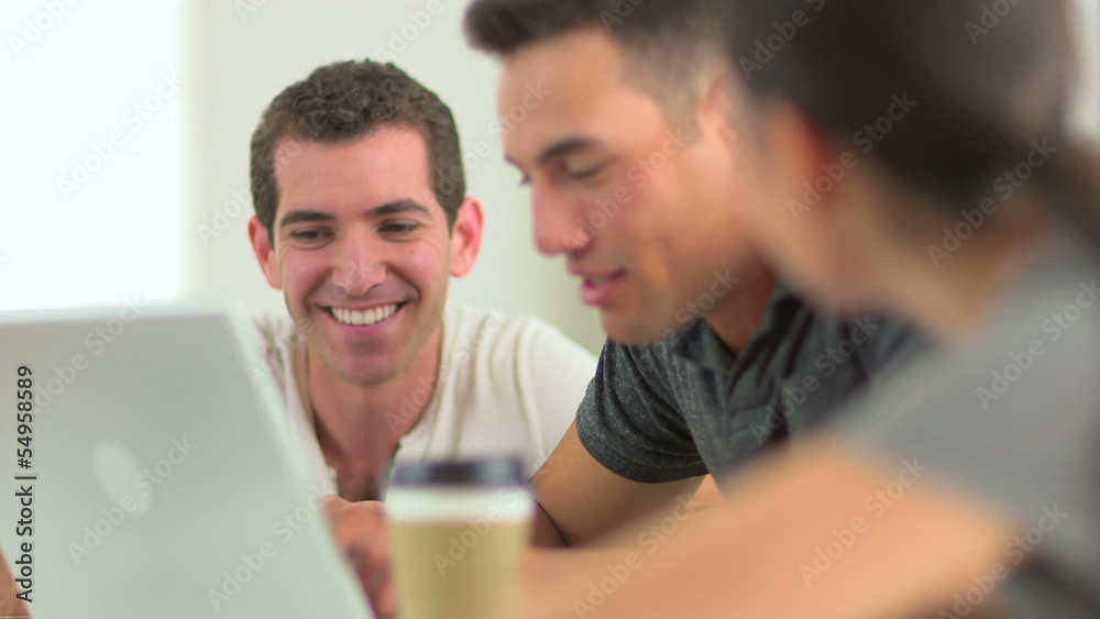 Close up of diverse group of office workers at laptop Close up of diverse group of office workers at laptop