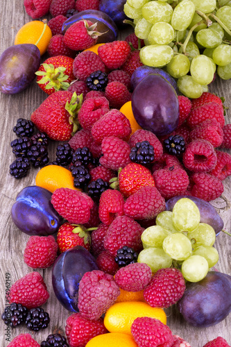 Fototapeta Naklejka Na Ścianę i Meble -  tasty summer fruits on a wooden table