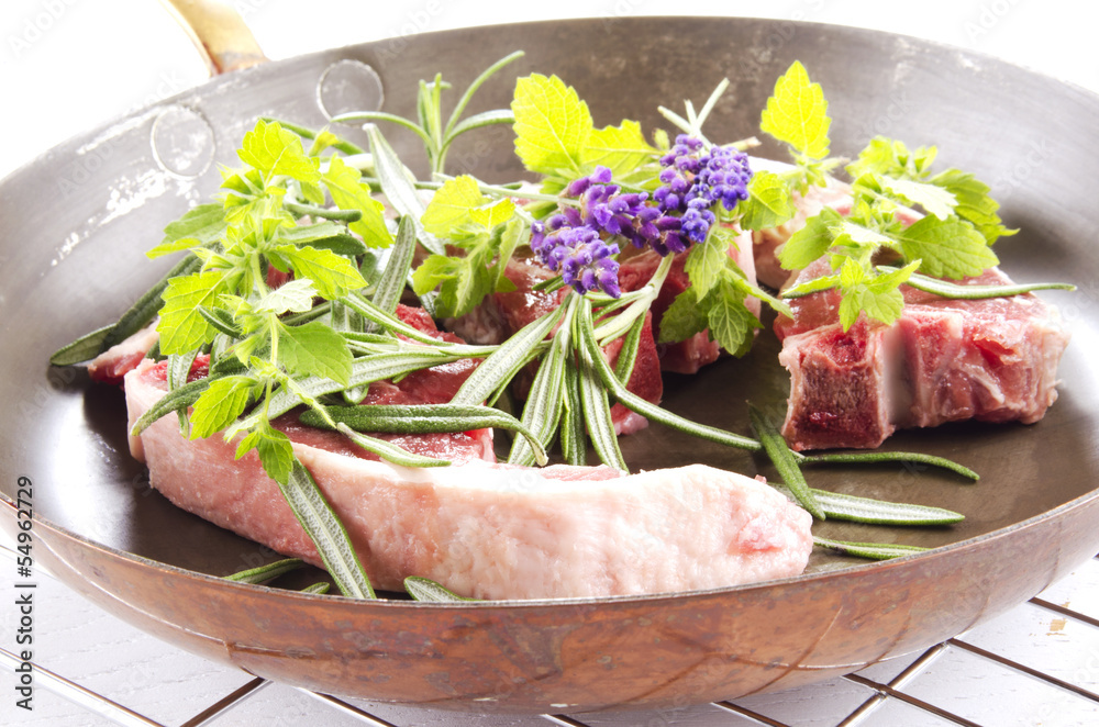 lamb chops in a brass pan