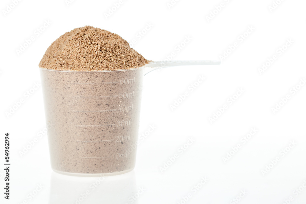 Plastic scoop of chocolate whey isolate protein foto de Stock