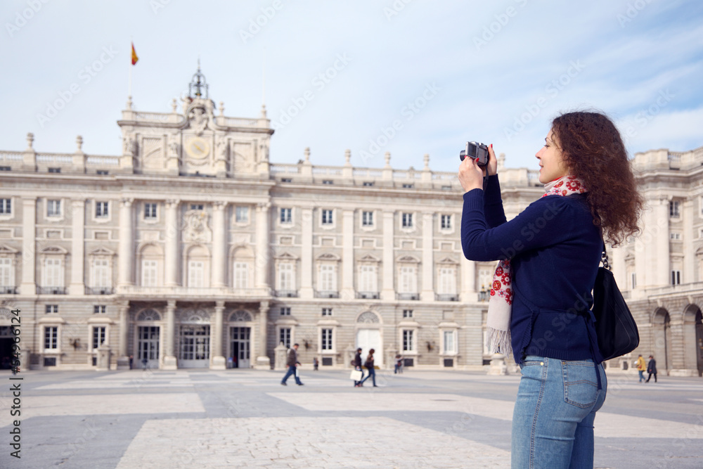 Young woman photographs palace of Spanish kings in Madrid