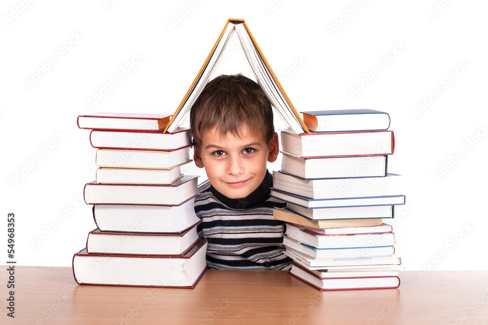 Schoolboy and a heap of books Schoolboy and a heap of books
