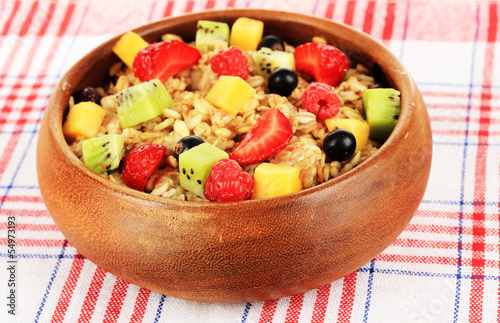 Oatmeal with fruits close-up