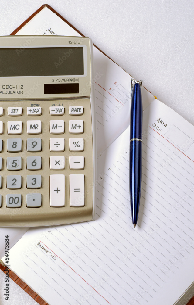 notebook with pen and calculator notebook with pen and calculator