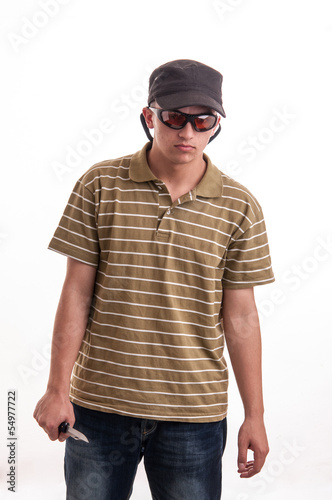 Burglar in with cap and sunglasses holding knife