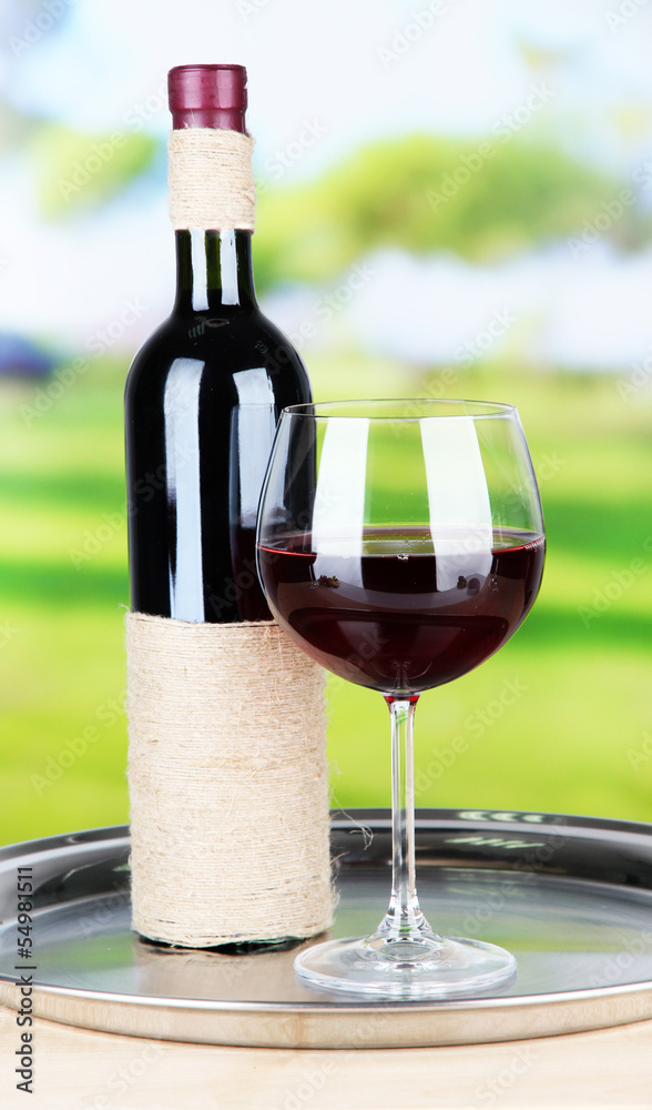 Wine glass and bottle on bright background Wine glass and bottle on bright background