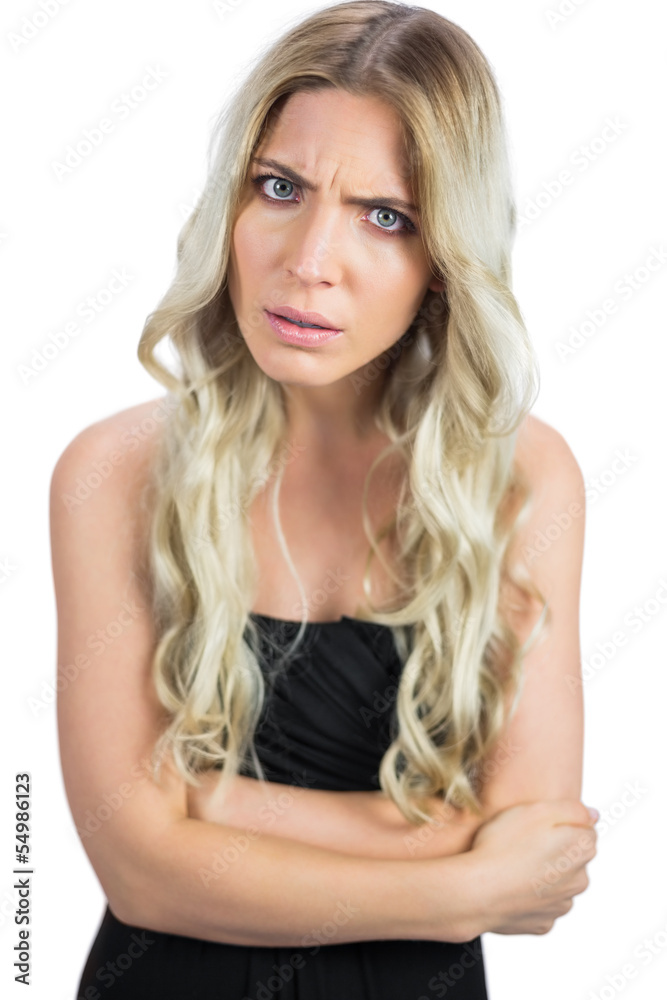 Gorgeous blonde wearing black dress frowning Gorgeous blonde wearing black dress frowning