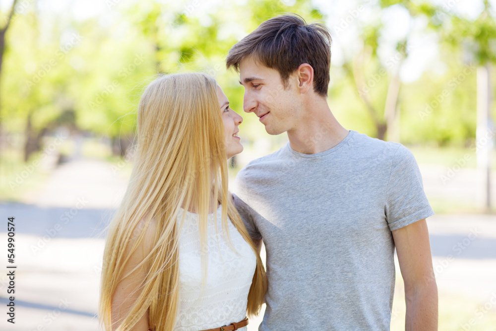 Young couple walking in a park Young couple walking in a park