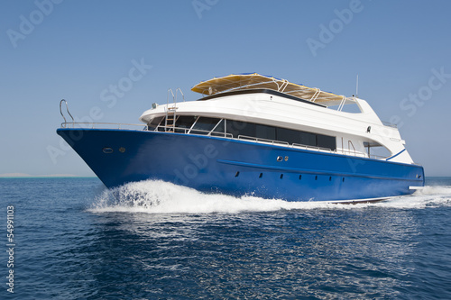 Large luxury motor yacht under way at sea