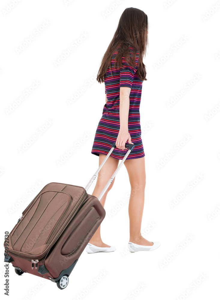 back view of walking woman with suitcase back view of walking woman with suitcase