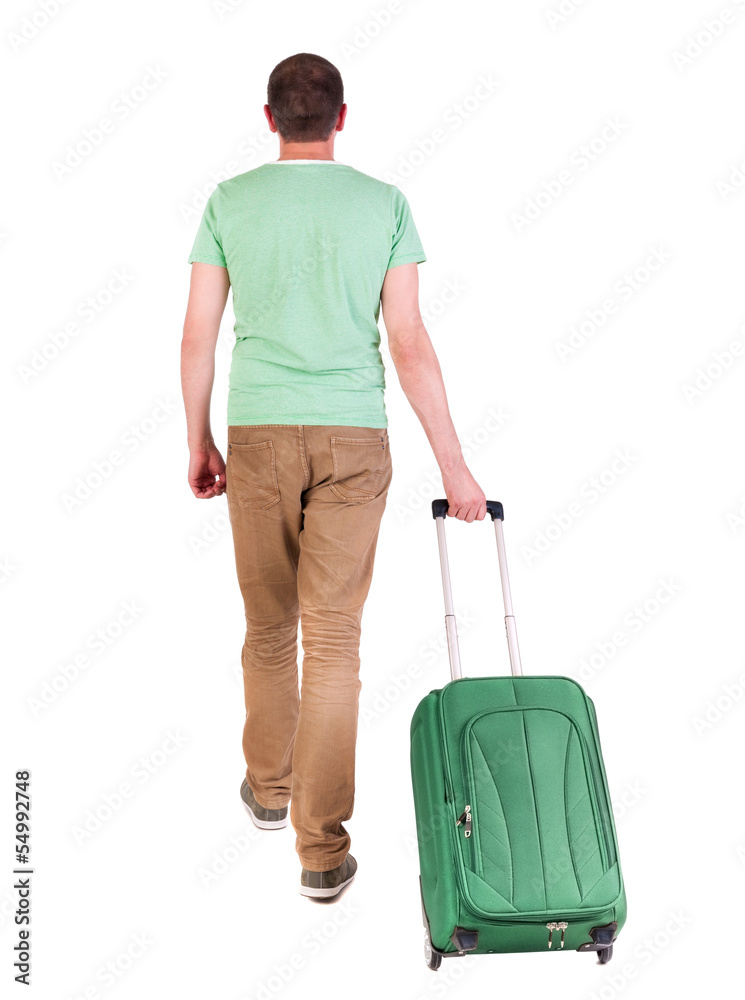 back view of walking man with suitcase. back view of walking man with suitcase.