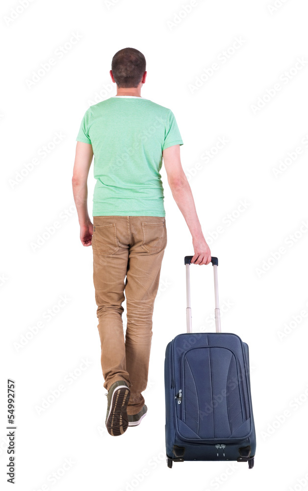back view of walking man with suitcase. back view of walking man with suitcase.