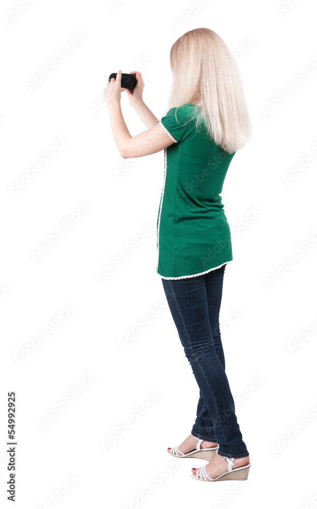 Back view of woman photographing. Back view of woman photographing.