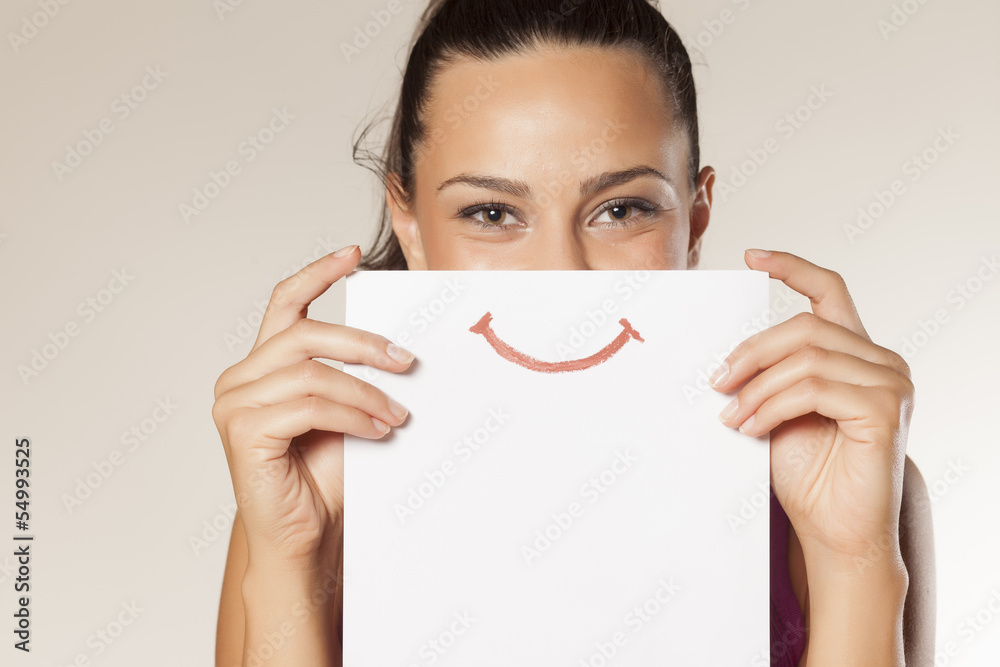 happy and smiling girl with a smile painted on paper - obrazy, fototapety, plakaty 