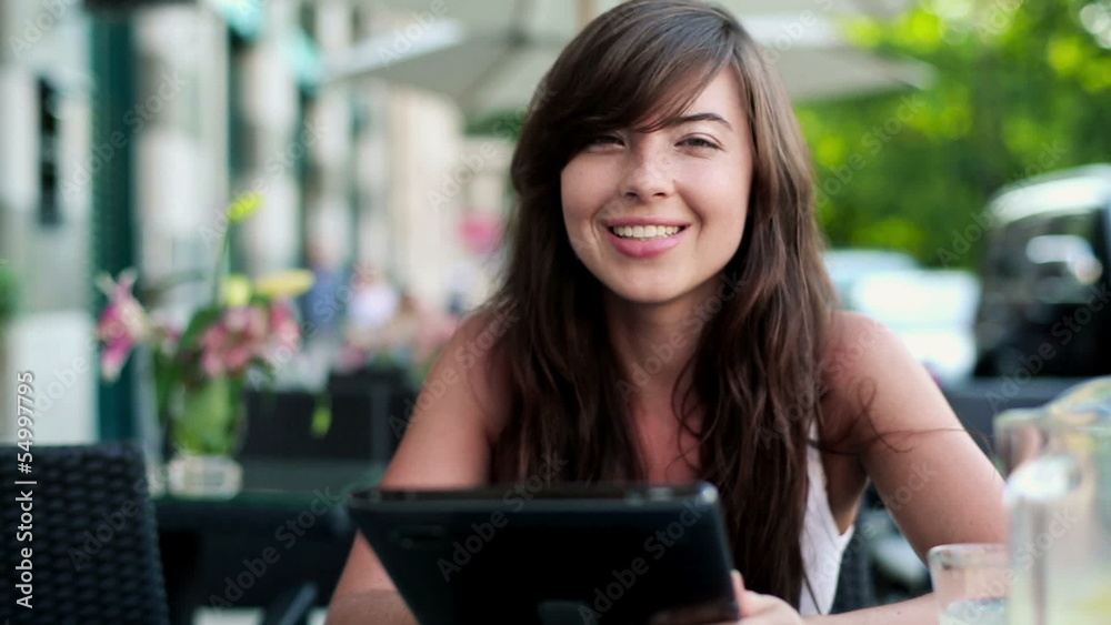 Happy woman with tablet computer in cafe, steadicam shot Happy woman with tablet computer in cafe, steadicam shot