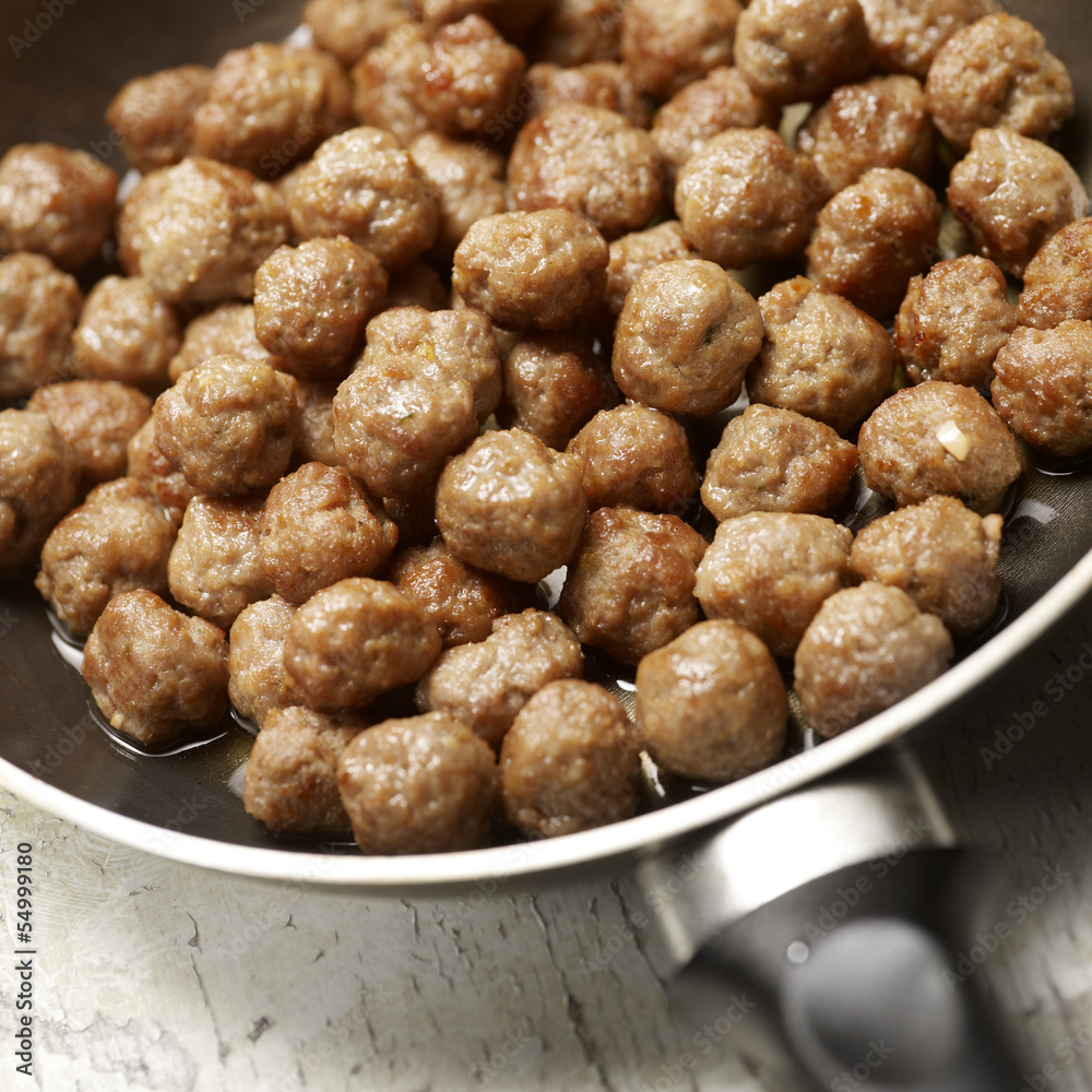 tasty meatballs beeing prepared in a frying pan tasty meatballs beeing prepared in a frying pan
