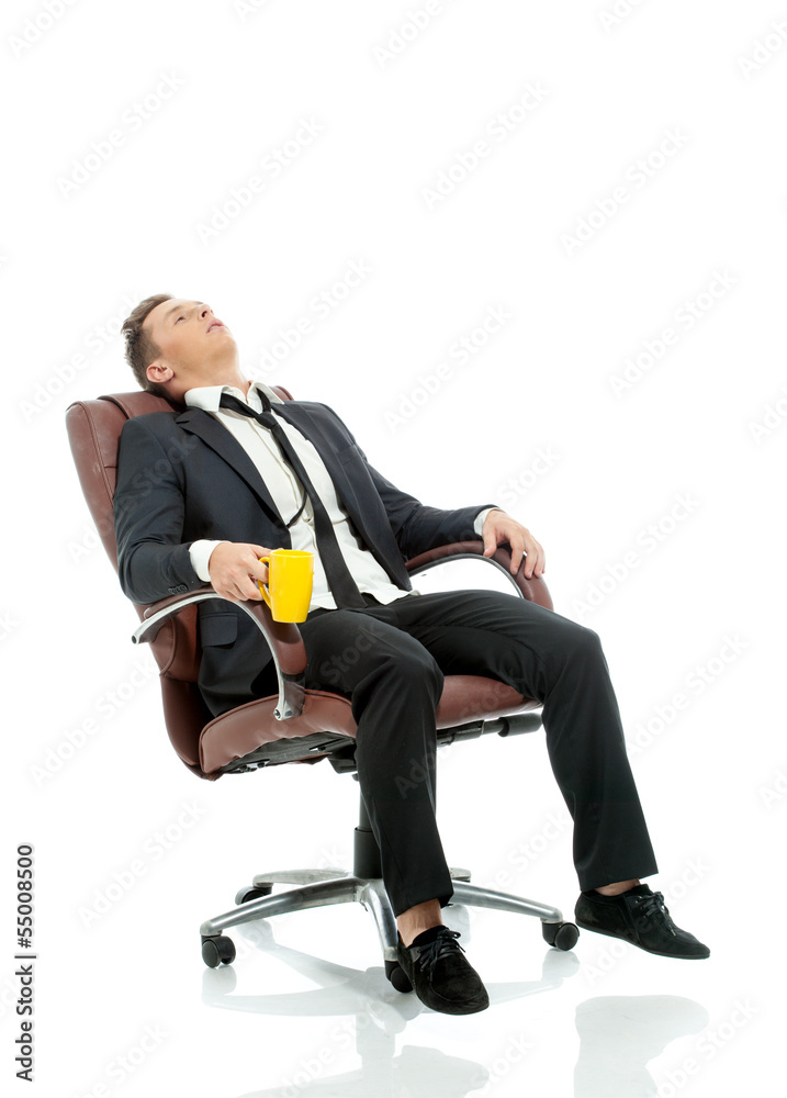 Image of tired office manager resting in chair Image of tired office manager resting in chair