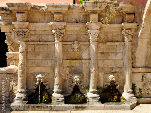 Old venetian fountain in city of Rethymno, Crete, Greece photo