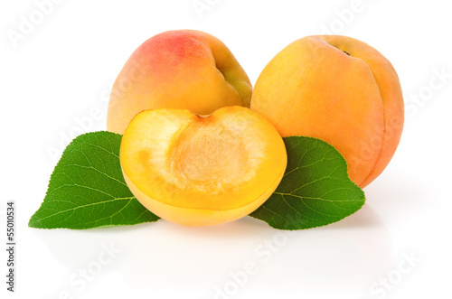 Ripe Apricots with Leaves Isolated on White Background