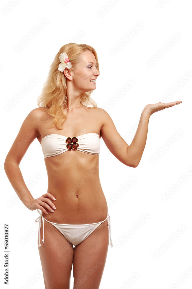 A young woman in a swimsuit showing something A young woman in a swimsuit showing something