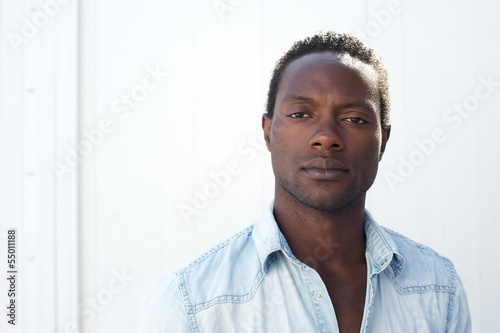 Portrait of a handsome black man against white background