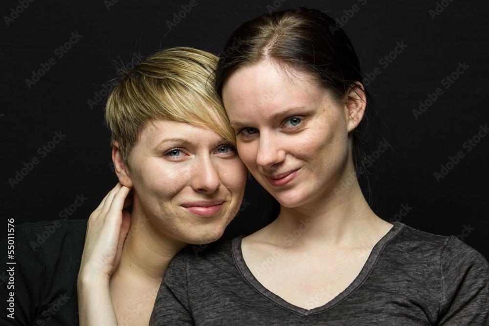 Girlfriends posing together and smiling, horizontal Girlfriends posing together and smiling, horizontal